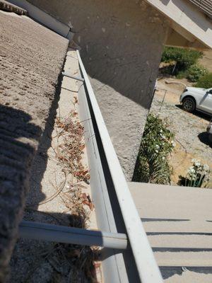 Rain gutter full of their sand