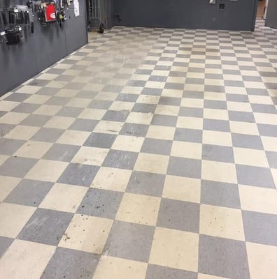 This floor was stripped and waxed to bring it back to its original glory. Such a great photo of what a great cleaning can do!