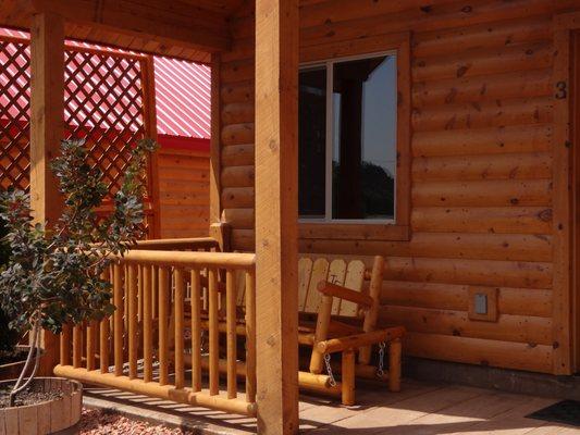 Our porches with a glider swing to sit and relax after a day of hiking our scenic wonderland.