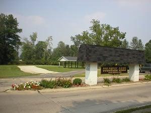 Colonial Oaks Main Entrance with the Bus Shelter for Midview Schools in the background.