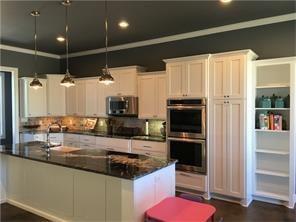 This kitchen has room to host a feast! I cook's dream! Look at the pantry next to the double oven! Call me to check it out!...