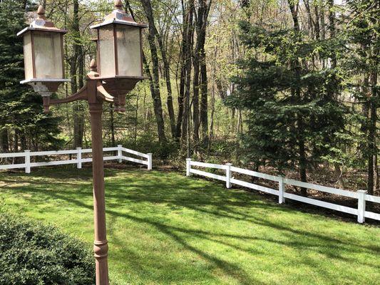 184' of  beautiful 2-Rail Vinyl Ranch Style Fence,  with Square Posts and New England caps to complete our back yard