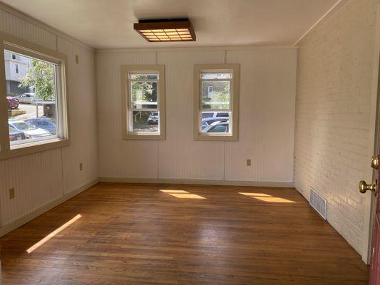 Original brick walls and wood floors showcased in our 104 W State home