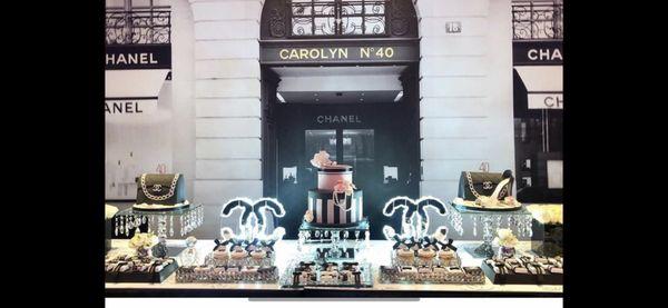 Chanel inspired surprise 40th birthday featuring a Parisian backdrop with delectable desserts and custom lights.