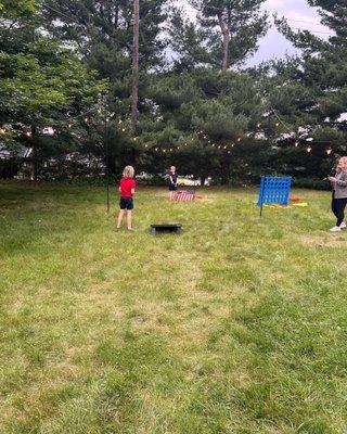 Kids playing Corn Hole