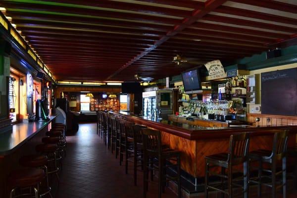 A nice long bar with comfortable stools.