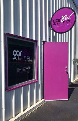 You can find Car Girl Auto with the fuchsia front door!