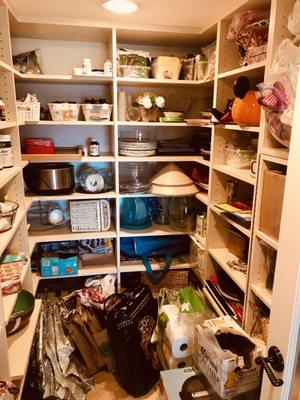 Unorganized and cluttered pantry -before