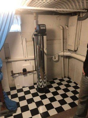 A basement install of a whole home water filter system.