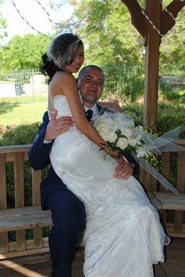 Faye F. And happy hubby In a lace overlay custom designed gown.