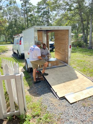 Derek and Brian making a new hood for a unit installed.