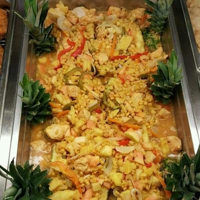 Brazilian Chicken....Chicken stuffed in half a pineapple with diced papaya, green,red,yellow peppers, and sweet Spanish onions