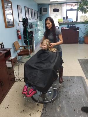 My youngest getting her hair trimmed also!