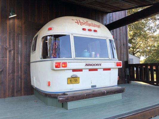 10/13/19. Sunday evening. From US-259, look for the gorgeous 1977 Argosy Travel Trailer jutting out of the front exterior of this business!