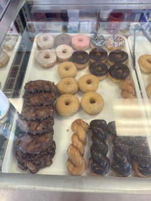 Apple fritter, twist and iced donuts