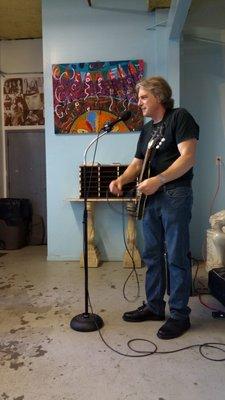 photo by Nancy Bechtol.  This is George John Larson, poet, musician, and artist on location at the event