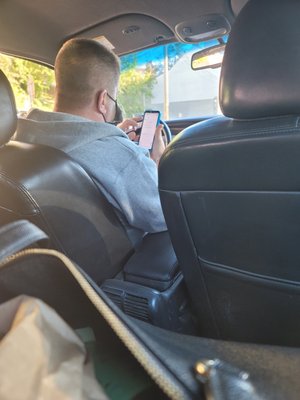 My driver was on his phone, when I asked him why he is using his phone while driving, he called me a nigger.