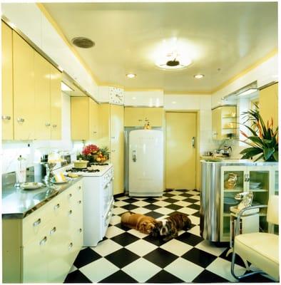 residential remodel new kitchen with 50's metal cabinets and white Marvel glass walls