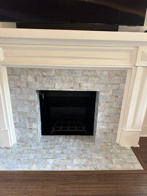 The newly tiled fireplace.