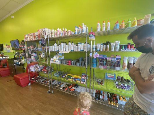 Shelfs of kid friendly hair stuff and toys for sale