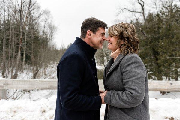 A couple ugga muggas during a winter engagement session