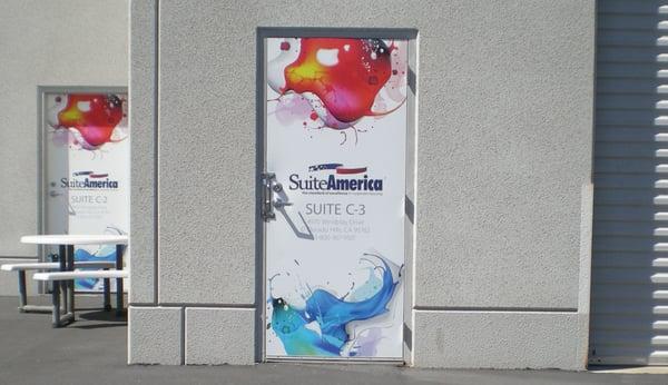 Wraps are NOT just for vehicles! Check out these cool door wraps at Suite America's corporate office.