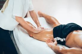 sports massage - tight hamstrings are being flushed off of lactic acids and tightness is being loosened up