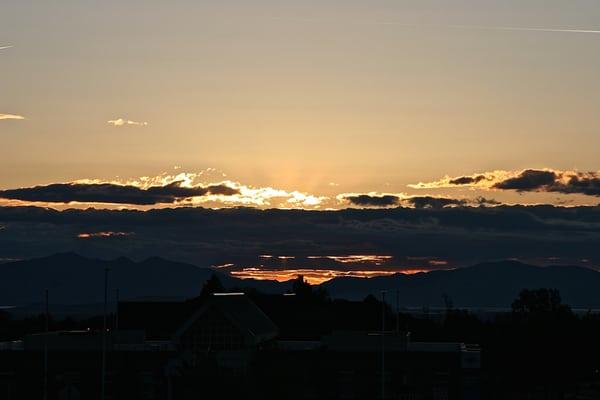 View of a cloudy sunset from Holy Family Catholic Church.