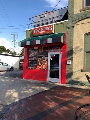 Order take out or weather permitting, nice tables and chairs just outside and they bring your food to you.