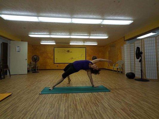 This is Heather, the instructor, demonstrating the PiYo flip from Downward Dog.