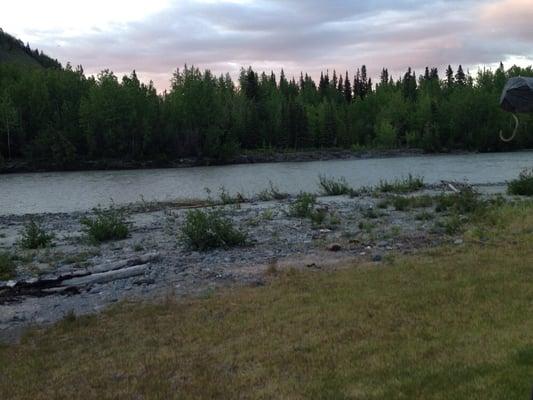 River behind lodge and cabins