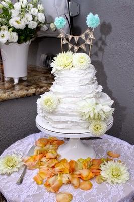 Our 3 tier ruffle wedding cake-2 tiers of Funfetti cake & 1 with yellow cake & vanilla buttercream!