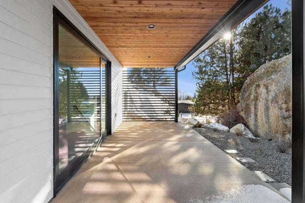 Patio with steel privacy screen.