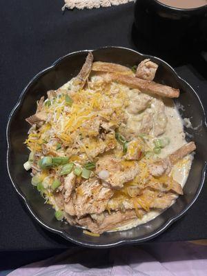 Battered Fries covered with green chile cheese sauce, grilled chicken, and cheese