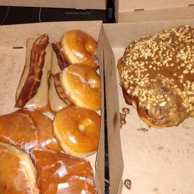 Here are some of their donuts Maple Bacon bars, glazed, fruit stuffed pie donuts and their giant peanut butter/ chocolate donut.