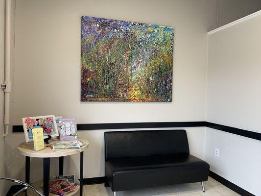 Nice waiting area with a gorgeous painting