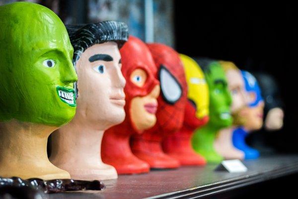 Series of Superhero ceramic heads by Tyler Spohn