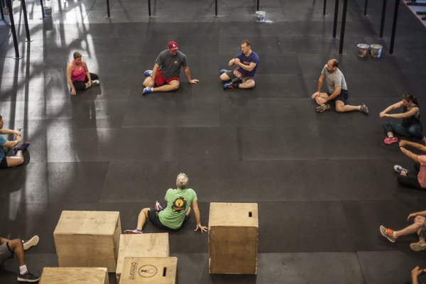 Stretching, lifting, supporting... this is what Wellness Revolution CrossFit is all about.