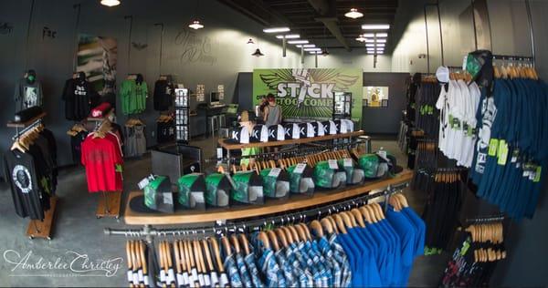 Inside retail area of Stick Tattoo Company featuring such brands as Sullen Clothing, Ink Addict, Metal Mulisha and more.