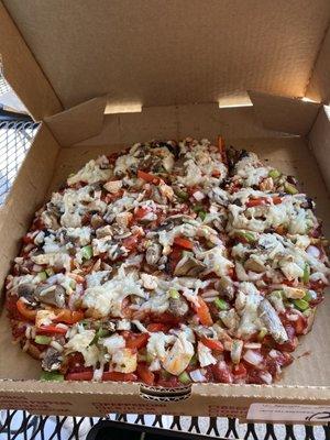 BBQ chicken pizza with dairy free cheese.