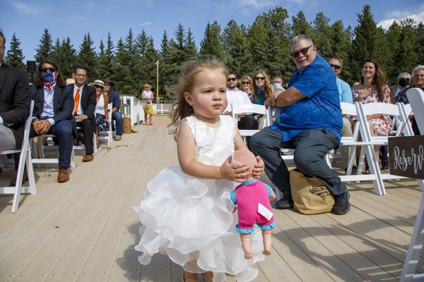 Flower girl after ditching the flowers and grabbing the doll.