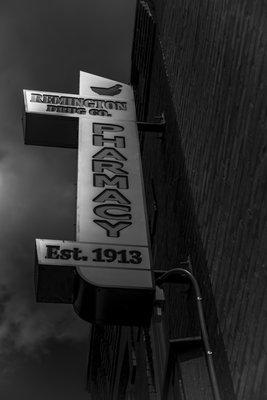 Vintage sign installed on the front of the pharmacy in June '19