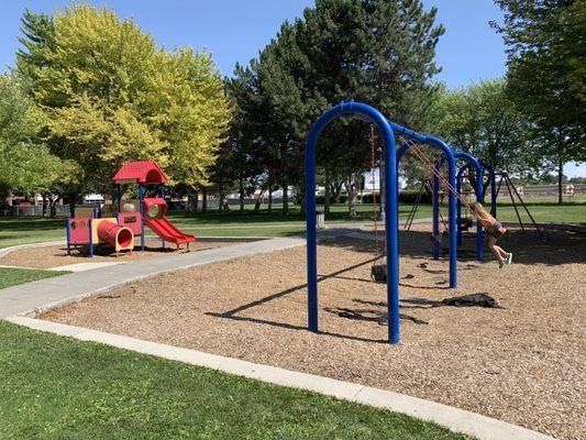 Several different pieces of playground equipment