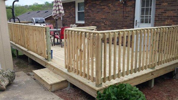 Custom wood deck with a gate.