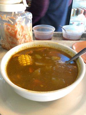 Mondongo - tripe and beef soup with carrots, celery, corn, yucca!