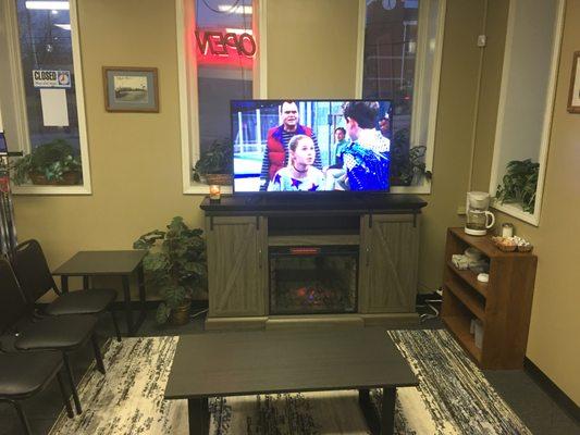 New TV With Fireplace For Customers While They Wait for Repairs