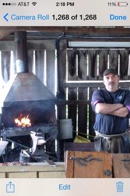 Out back is a Blacksmith demonstrating his work!