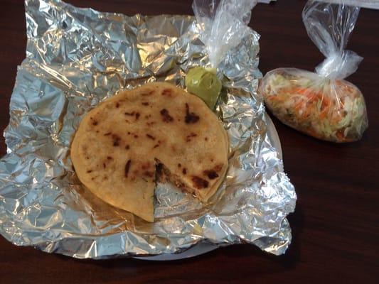 Two HOT pupusas w/spicy green sauce & curtido. Simply wrapped in foil on a paper plate, no knife & fork. Only $1.50/ ea.