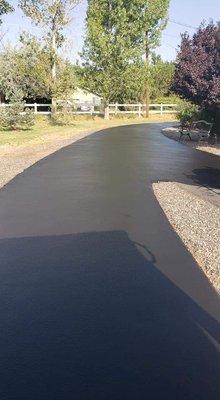 Freshly sealed driveway done by Cj's