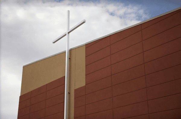 Cross on side of building.